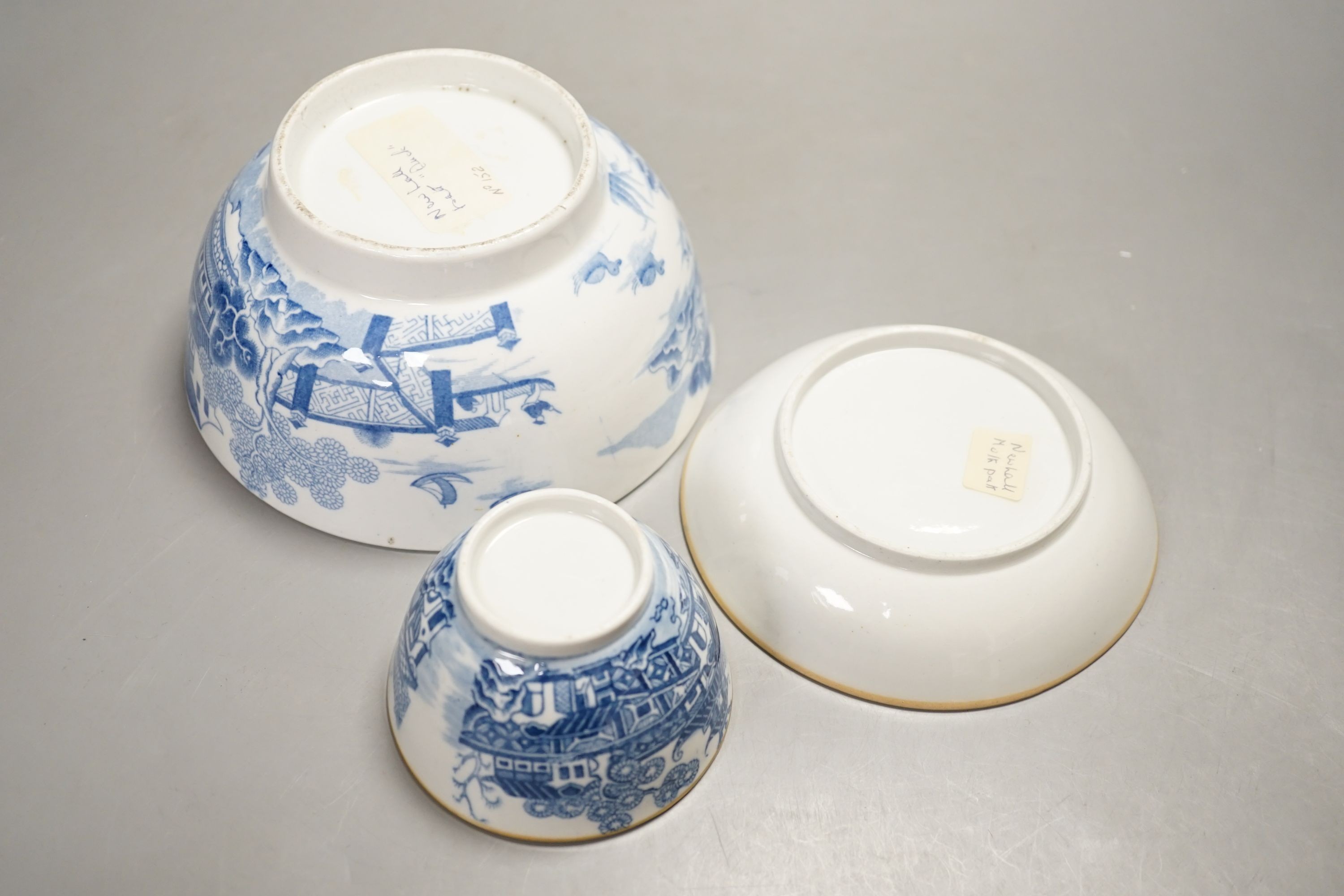 A New Hall slops bowl printed with the 'Duck' pattern and a teabowl and saucer printed with the 'Moth' pattern c.1790, Slops bowl 15.5 cms diameter.